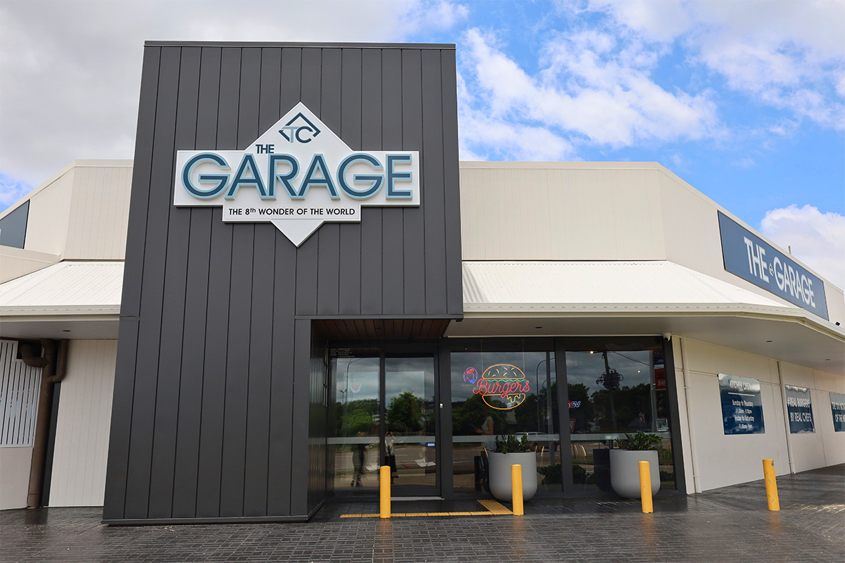 The Front view of The Garage at Twin City Hotel, featuring a lively, Australian-themed burger bar in Townsville.